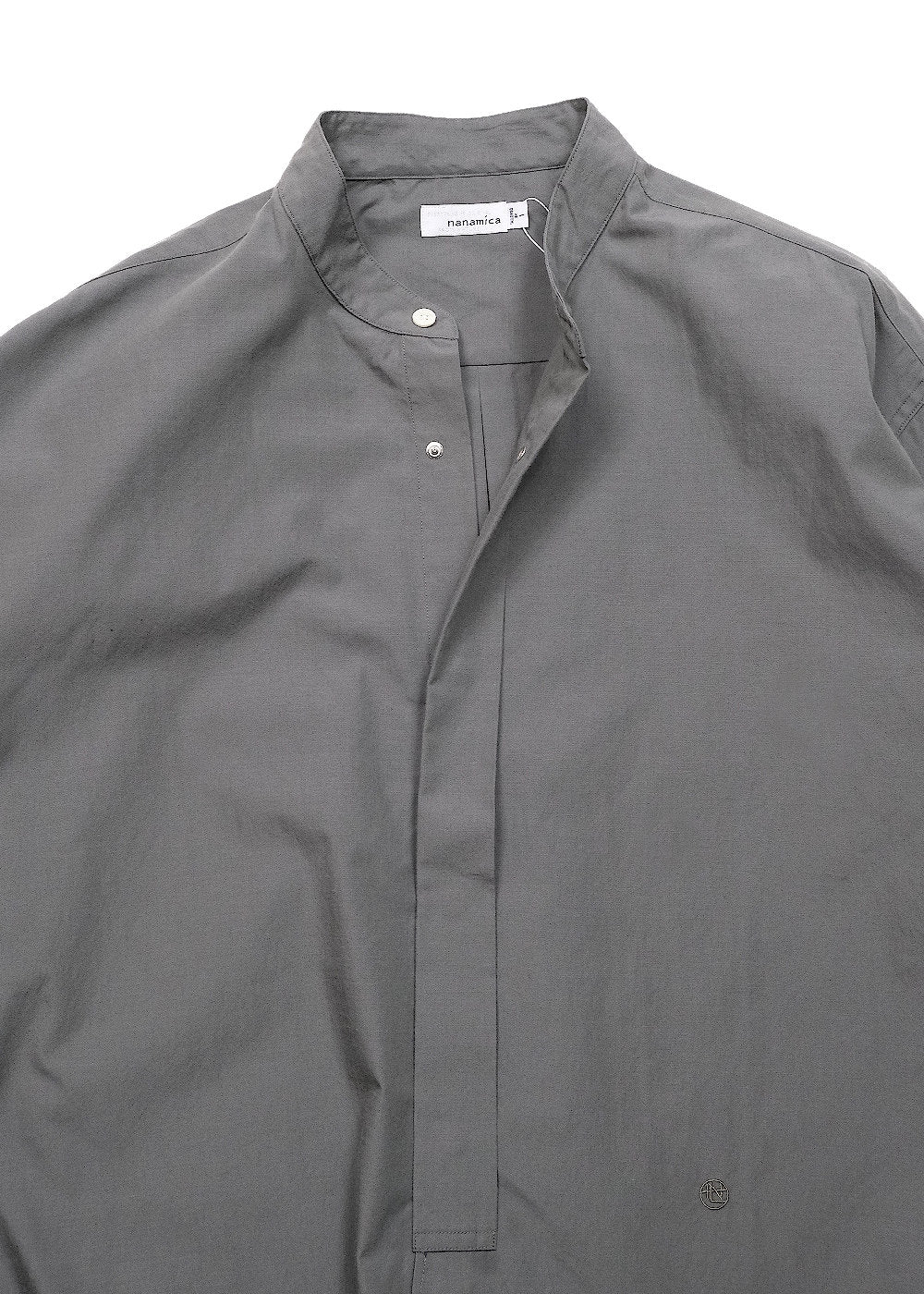 A close-up of a dark gray long-sleeve button-up shirt with a band collar, laid flat against a white background.